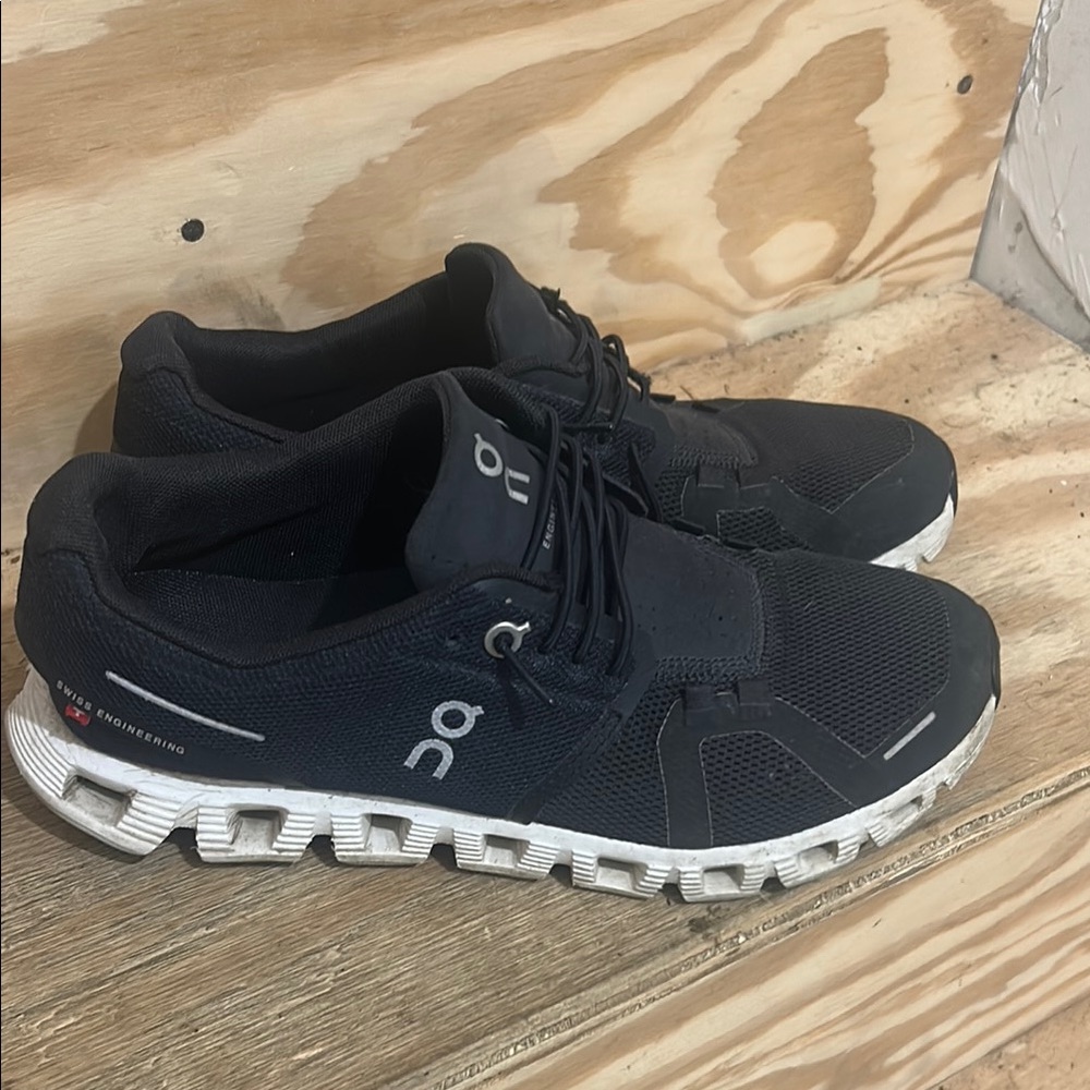 On Running Black and White Athletic Shoes with Cloud Cushioning